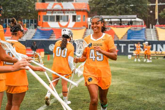 Kayla Wood smiling during pregame introductions.