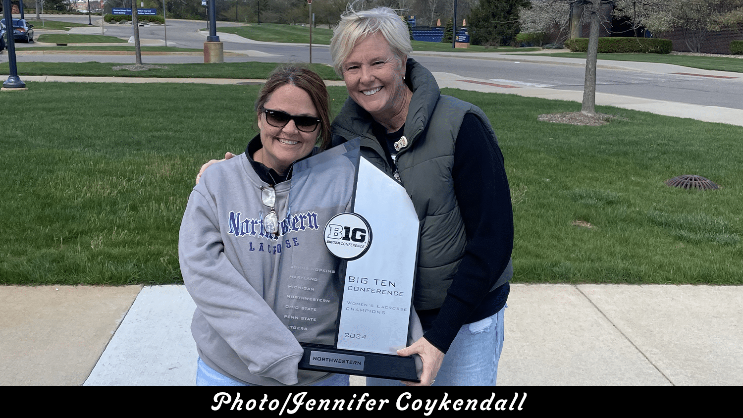 (Photo/Jennifer Coykendall) Jennifer Coykendall, left, and Patricia Scane, right, pictured with the 2024 Big 10 Women's Lacrosse Championship trophy.