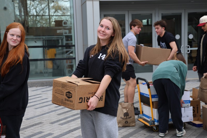 (Photo/Rory Meehan) Rory with a box she helped pack full of food for those in need.